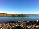 The campsite is between the ocean and the Paturau River.