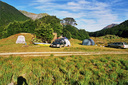 Camp next to the river at the head of the reservoir.