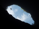 Caver absailing Harwoods hole with a very long rope