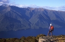 Tramper looking over South Arm, Lake Te Anau