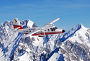 Air Safaris Nomad alongside Mount Cook.