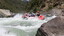 A crew crashing through Dog's Leg Rapid. Grade 3