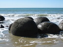 Tide swallowing the boulders