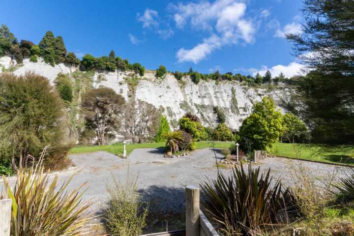 Set amongst native gardens and white papa cliffs