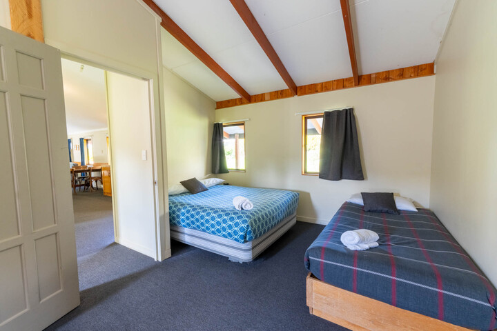 room 4 with a double bed and three singles 