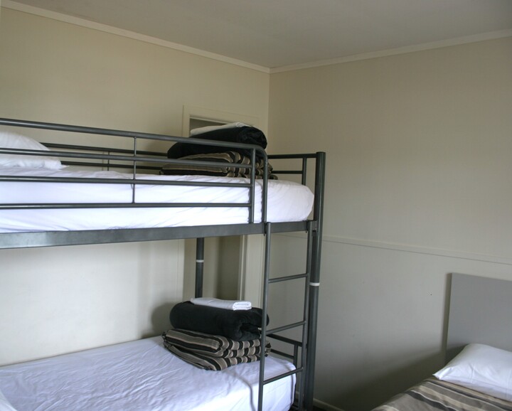 Separate bedroom, queen bed and single bunks